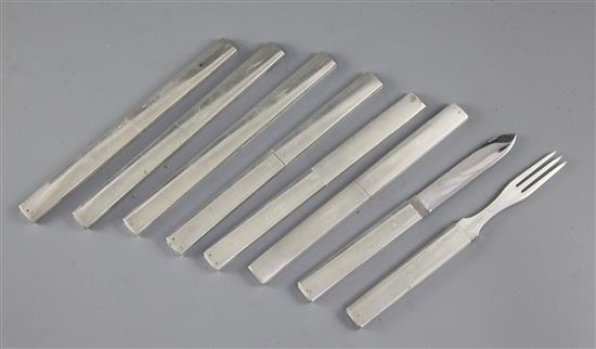 A set of seven Louis Vuitton 800 standard silver and stainless steel integral travelling knife and fork sets.